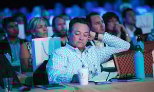 event-attendee-taking-notes