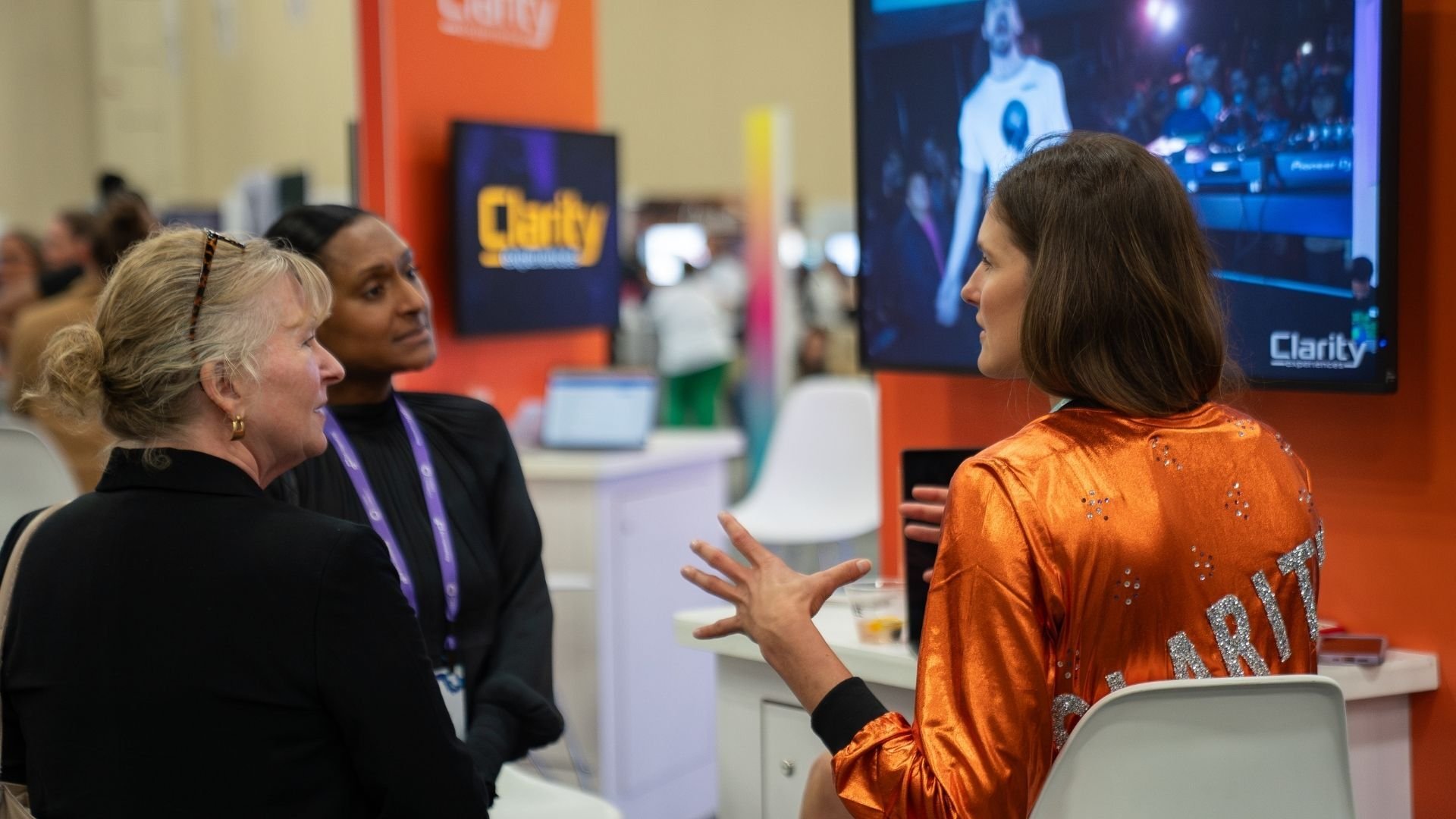 Clarity Person Speaking With Event Planners At Cvent Connect 2024 On the trade show floor