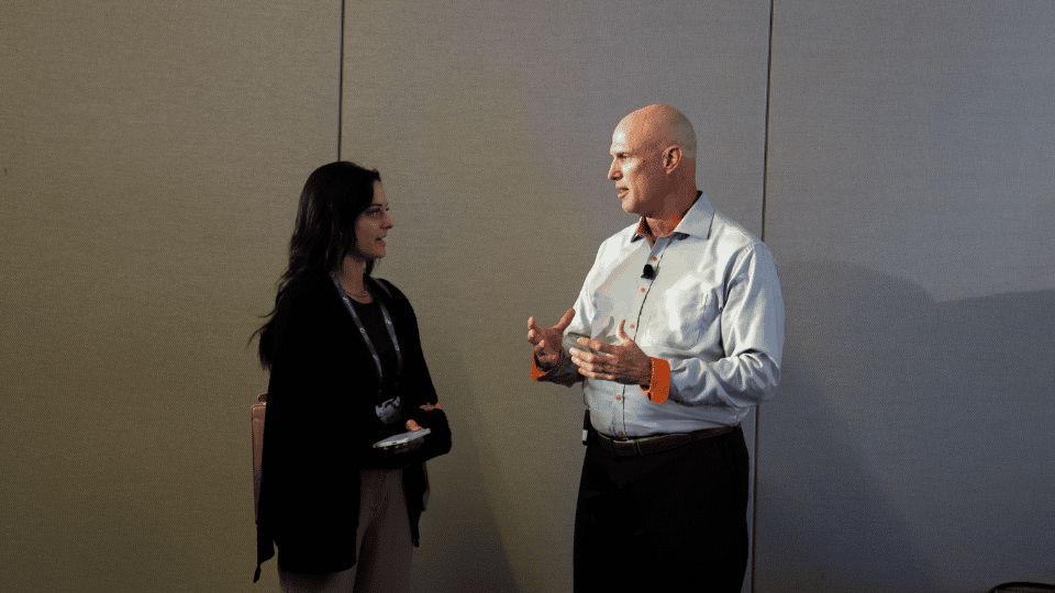 Imagine of two people talking at Cvent discussing partnership opportunities