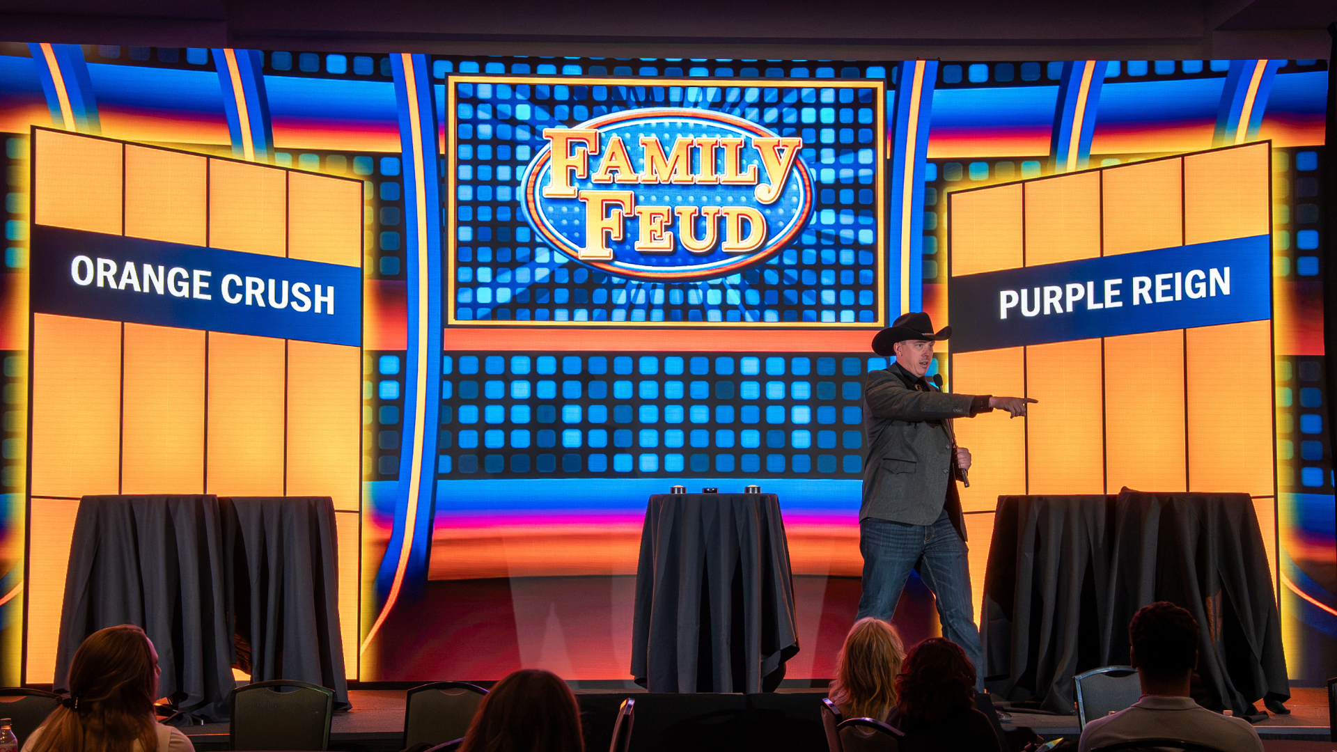a picture of a family feud host, hosting a gameshow at cvent in nasheville