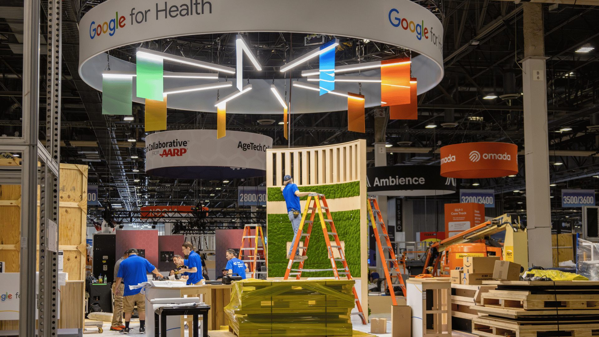 photo of workers setting up a trade show booth at an event