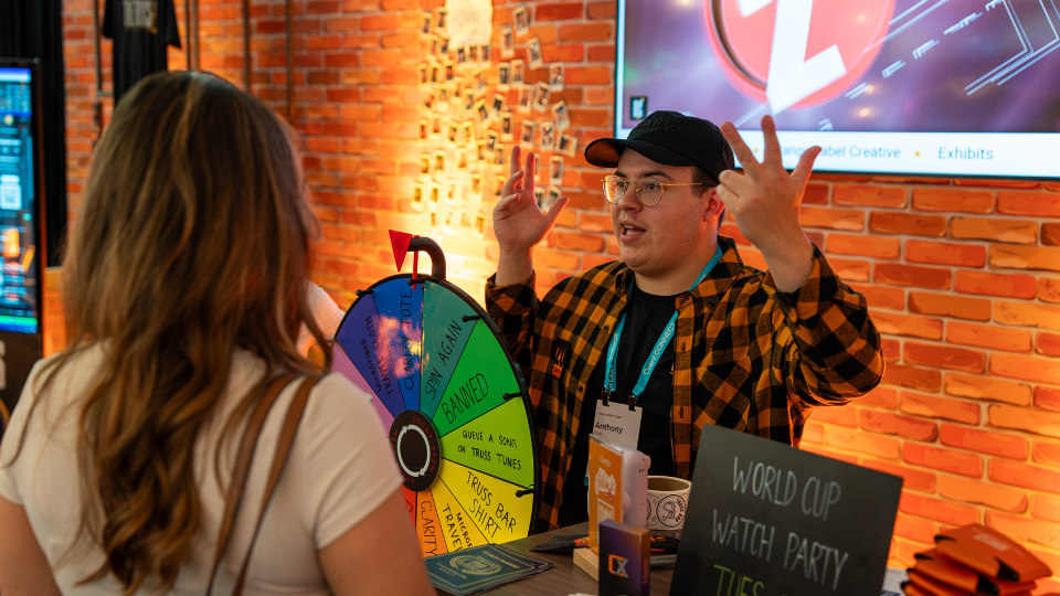 an attendee at cvent connect 2026 using the prize spinning wheel